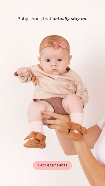 This ad for baby shoes features an image of a baby being held up, wearing a pair of the brand's shoes. The headline 