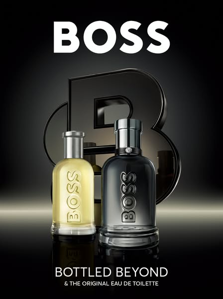 This ad showcases two BOSS Bottled fragrances against a dark background with a large ‘B’ logo in the background. It aims