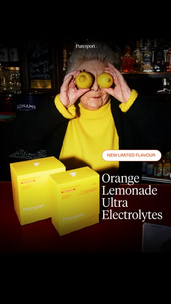 The ad shows an elderly woman at a bar holding lemons over her eyes. The product is displayed in the foreground with the
