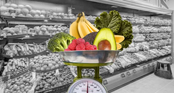 This ad features fresh produce weighed on a scale against the backdrop of a grayscale supermarket. The intent of the ad 