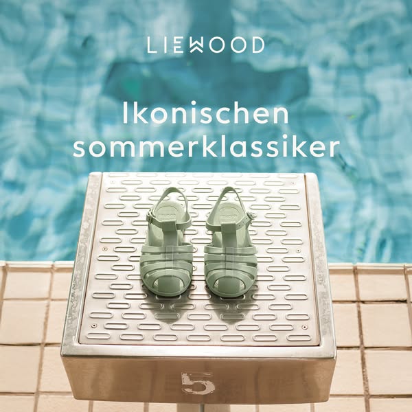 This ad showcases Liewood's light green summer sandals. The sandals are styled on a poolside block, suggesting the s