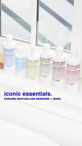An ad for Malin+Goetz skincare products showcasing some of their 'iconic essentials.'
