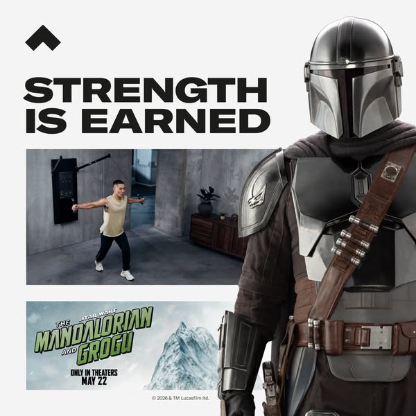 An ad featuring a person working out in front of a wall-mounted weight machine. The copy reads, 'Strength is earned&