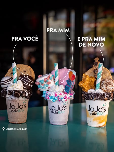 This ad showcases three distinct milkshakes from JoJo's Shake Bar, each customized with a variety of toppings and pr