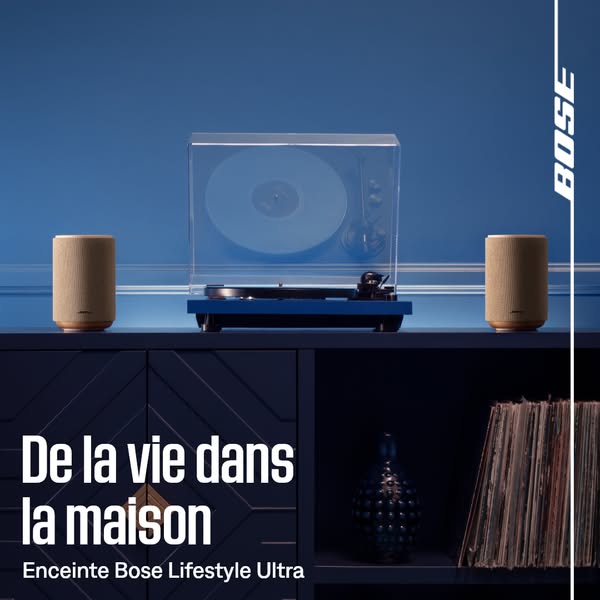 A blue-toned image ad showcasing the Bose Lifestyle Ultra speaker next to a record player.