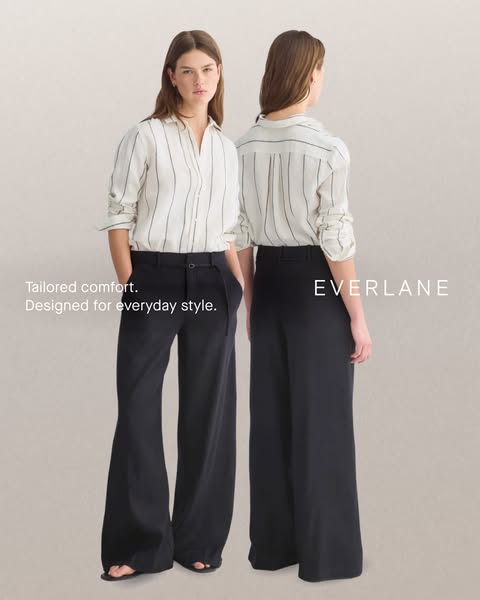 The ad features two models wearing the same wide-leg pants and button-down shirt, presented in a simple studio setting.