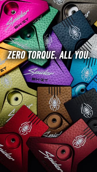 This ad features an arrangement of Spider SK-ZT golf putters in various colors. The headline emphasizes the putter's