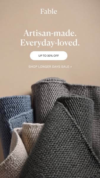 This ad for Fable promotes their rugs. The ad features a stack of rolled-up rugs in various colors and textures. Text at