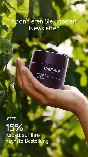 A skincare product advertisement featuring the Caudalie Premier Cru La Crème. The ad highlights a 15% discount and encou