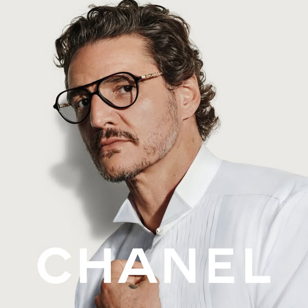 This ad features a close-up shot of actor Pedro Pascal wearing black-framed glasses with the Chanel logo on the temples.