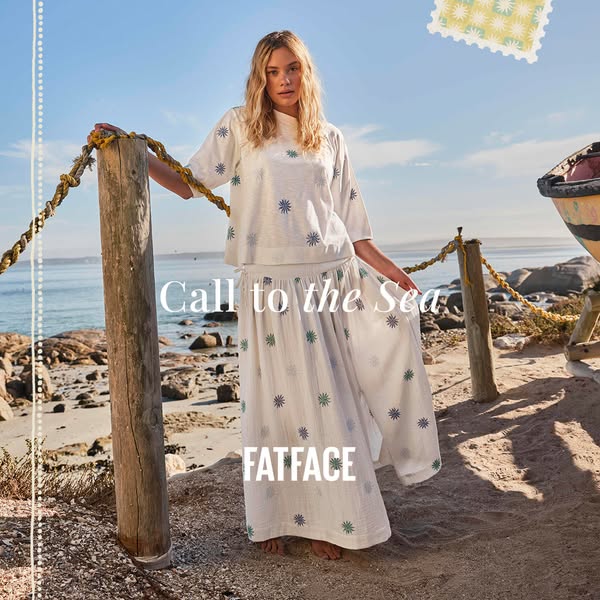 An ad for FatFace featuring a woman in a matching top and skirt, posing on a beach. The ad evokes a summery, vacation vi