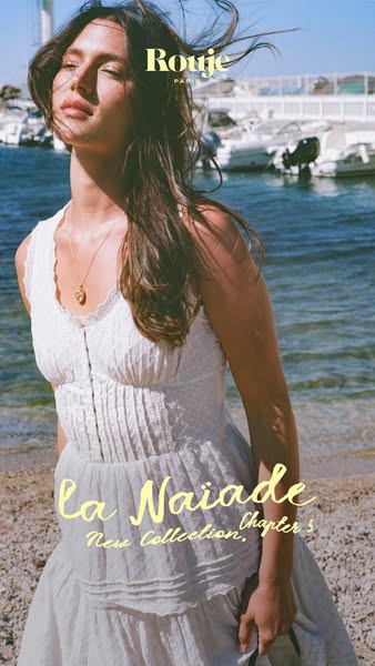 This image ad for Rouje promotes a new collection, La Naiade Chapter 5, featuring a woman in a white dress by the water.