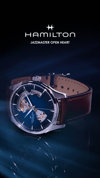 A close up of the Hamilton Jazzmaster Open Heart watch is shown in an artistic product shot. The Hamilton brand name is 