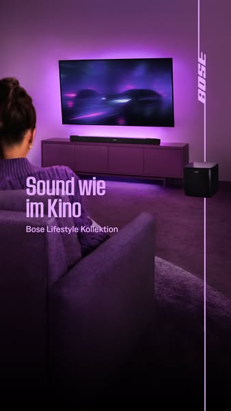 This image ad for the Bose Lifestyle Kollektion features a woman sitting on a couch in a darkened room watching televisi