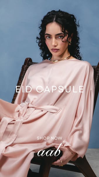 This ad showcases Aab's Eid Capsule collection featuring a woman wearing a pink satin robe. The image is a medium sh