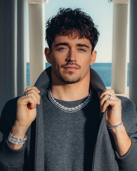 This ad features Charles Leclerc, a race car driver, wearing jewelry. The jewelry includes necklaces, bracelets, and rin