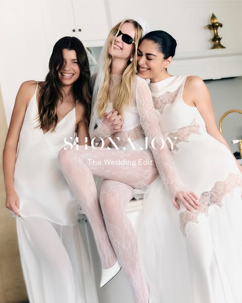 This image ad features three women in white dresses. The woman in the center is wearing a veil and sunglasses while the 