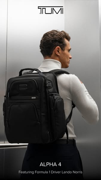 This image ad for TUMI features a single image of Formula 1 driver Lando Norris wearing the black ALPHA 4 backpack. It h