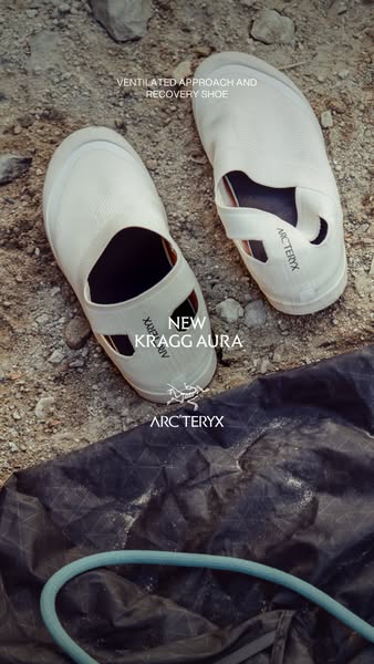 This image ad showcases a new recovery shoe from Arc'teryx. The shot is from above, showing the shoes on a rocky, ou