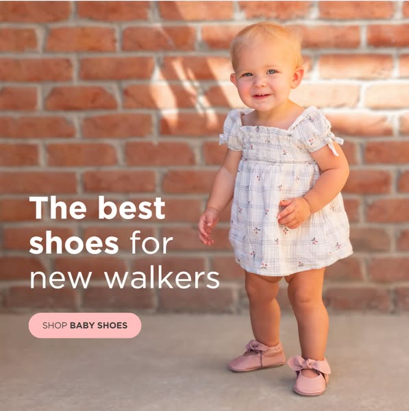 This ad uses an image of a smiling toddler wearing soft sole baby shoes. The ad promotes soft soled shoes for new walker