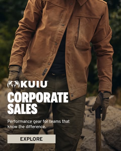 The ad promotes KUIU corporate sales, featuring performance gear for teams. The image showcases a person wearing KUIU ap