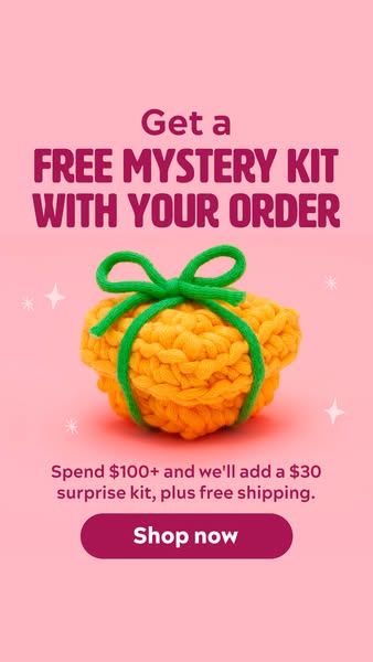 This ad promotes a free mystery kit with orders of $100 or more, plus free shipping. It features a pink background with 