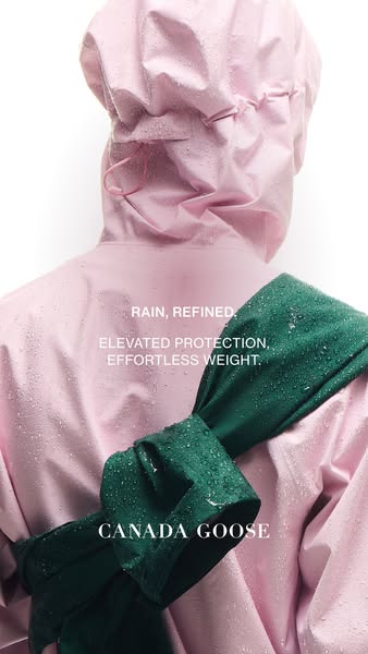 This ad showcases the Canada Goose brand, emphasizing refined rainwear. It features a close-up shot of a person wearing 