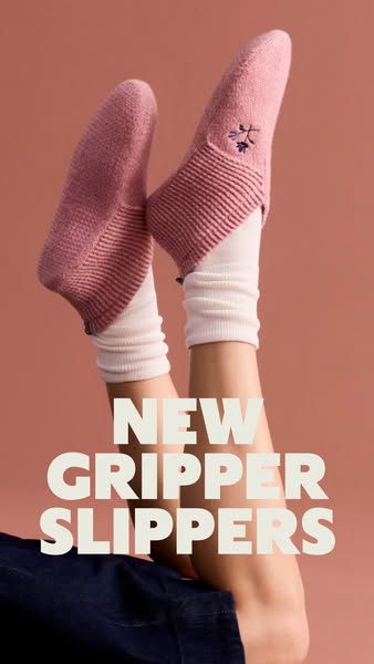 An advertisement for new gripper slippers. The ad features a person wearing a pair of slippers while laying on their bac