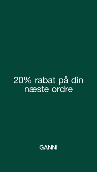 This ad for GANNI features a simple design with a dark green background and white text promoting a 20% discount on the n
