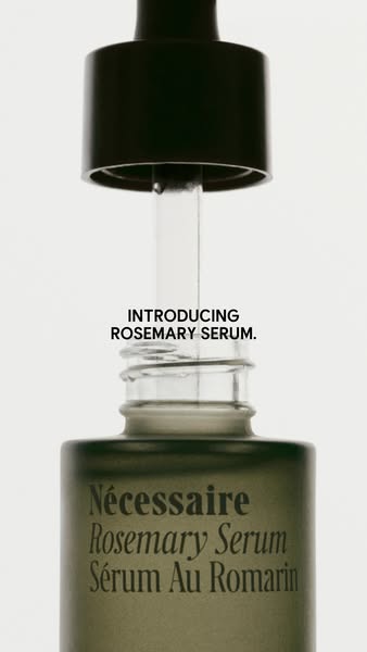 This ad showcases Nécessaire's Rosemary Serum. The ad features a close-up shot of the product bottle with the droppe