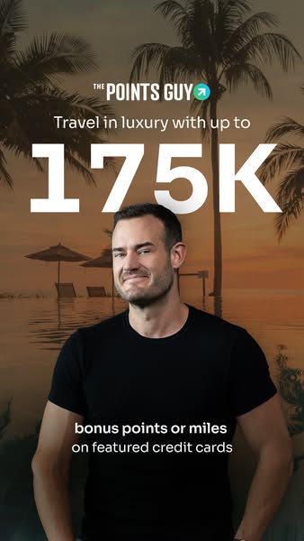 This ad for The Points Guy features a man in front of a tropical resort background, promoting travel in luxury with up t