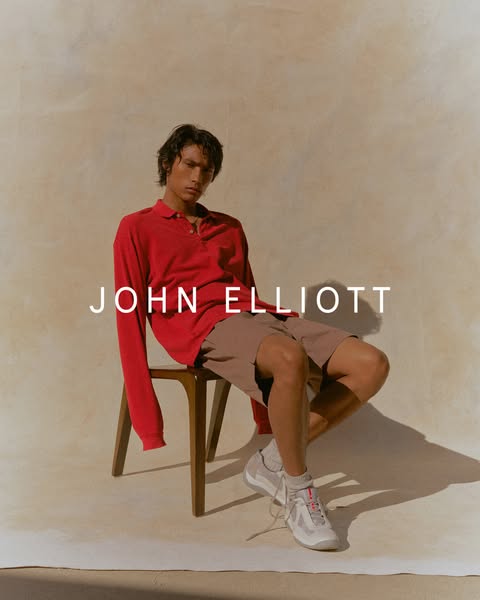 An image featuring a person wearing John Elliott apparel. The focus is on showcasing the clothing and the overall aesthe