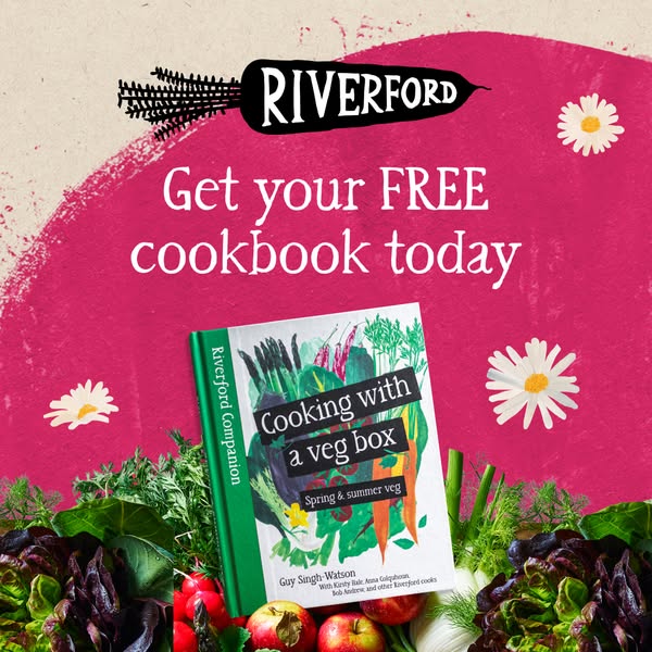 This image ad for Riverford promotes a free cookbook. The cookbook and surrounding fresh vegetables suggest a brand focu