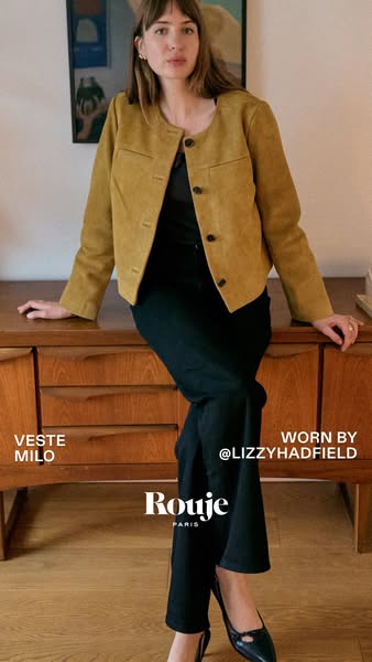 This ad features a woman wearing a Rouje Paris jacket. The ad highlights the jacket's style and fit, and also mentio