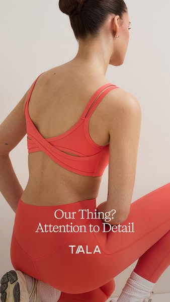 This ad for TALA features an image of a woman wearing a matching coral-colored TALA sports bra and leggings. The ad emph