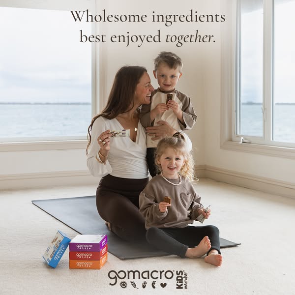 This ad showcases GoMacro Kids MacroBars as a wholesome snack choice for families. It features a mother and her two chil