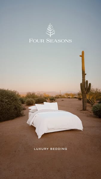 This ad showcases Four Seasons' luxury bedding by placing a bed in a desert landscape, emphasizing comfort and escap