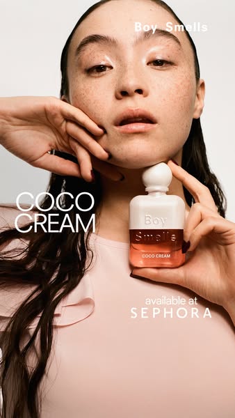 This ad showcases the Boy Smells Coco Cream fragrance with a close-up shot of a model holding the perfume bottle.