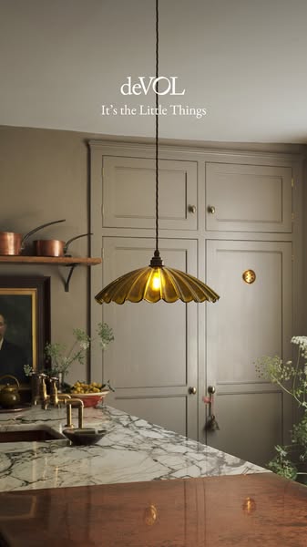 This ad showcases a deVOL pendant light in a kitchen setting, emphasizing the brand's focus on the beauty of small d