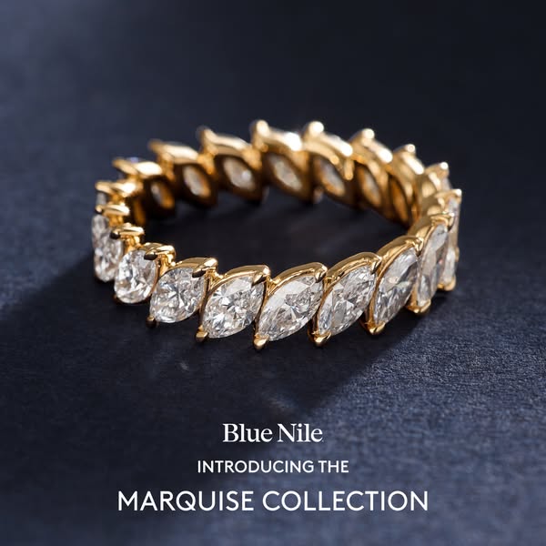 This ad showcases a gold ring with marquise cut diamonds from Blue Nile's new Marquise Collection.