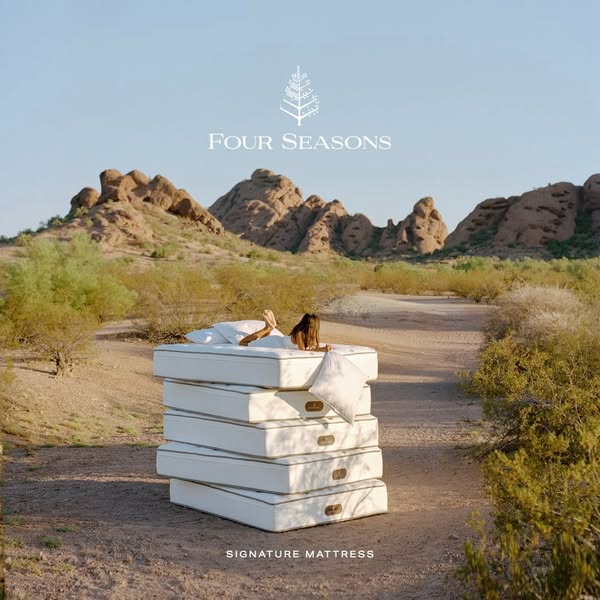 This image ad promotes Four Seasons mattresses with a serene desert landscape, stacking mattresses, and a person relaxin