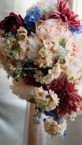 This image ad features a lush, colorful floral arrangement, likely promoting a floral design service for weddings or spe