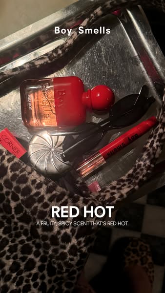 This ad features Boy Smells' Red Hot fragrance and other red-themed products in a stylish, lifestyle-focused image.
