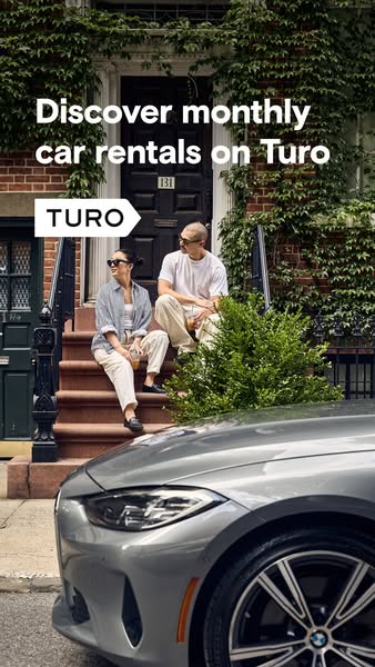 The ad showcases a couple sitting on the steps of a brownstone next to a parked car. The ad promotes Turo's monthly 