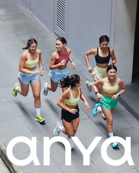 This ad features five women running together in activewear. The brand name is displayed at the bottom of the image.