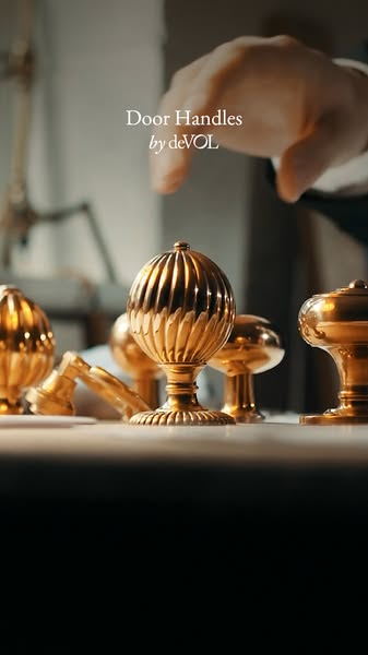 A product showcase ad for deVOL door handles, focusing on the product and brand.
