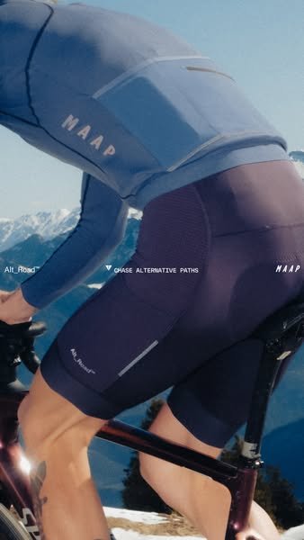 This image ad showcases a cyclist wearing the brand's apparel. It highlights the apparel's design and functional
