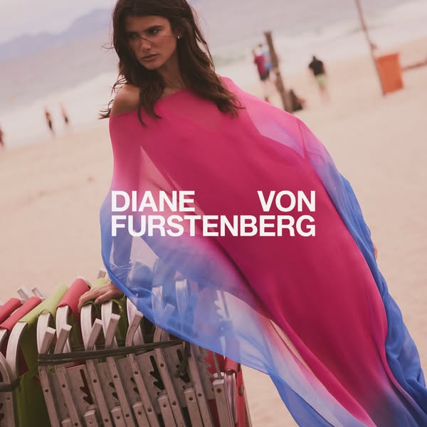 This ad features an image of a model on a beach wearing a blue-to-pink gradient flowing wrap. The brand name "DIANE