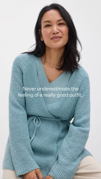 This ad features a woman wearing a blue wrap sweater and a blue top. The ad's message is that a good outfit can make