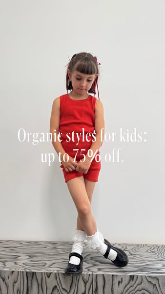 This image ad features a young girl modeling a red two-piece outfit. The ad promotes organic styles for kids with a disc